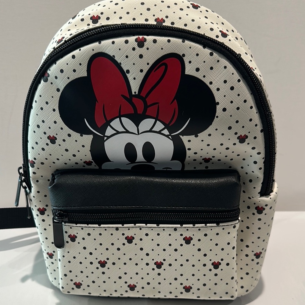 NWT Disney Minnie Mouse Small Backpack with adjustable straps and front pocket.